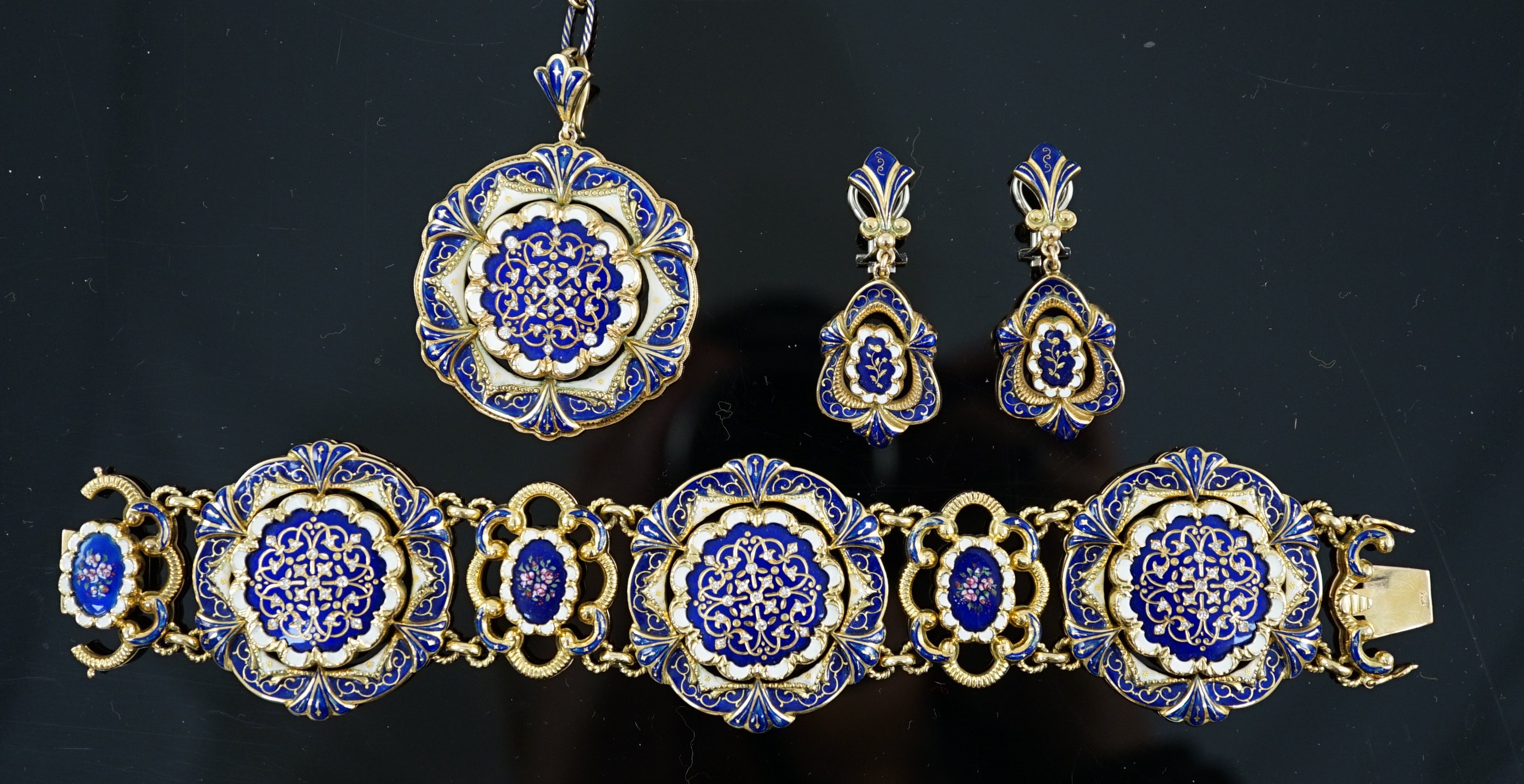 A mid 20th century Swiss 18ct gold and polychrome enamelled suite of jewellery, retailed by E. Meister, Zurich